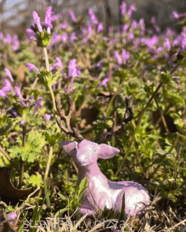 animated gif of the deer's antlers changing color over time from brown, to green, blue, then purple.