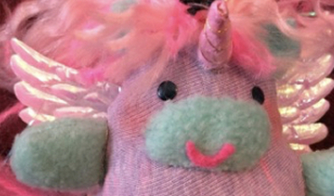 Four hand sewn plushies in pastel colors. A unicorn, two cats, and a rabbit. Thave have clear vinyl pockets in their bellies filled with confetti, they are scented, and have jingle bells inside.